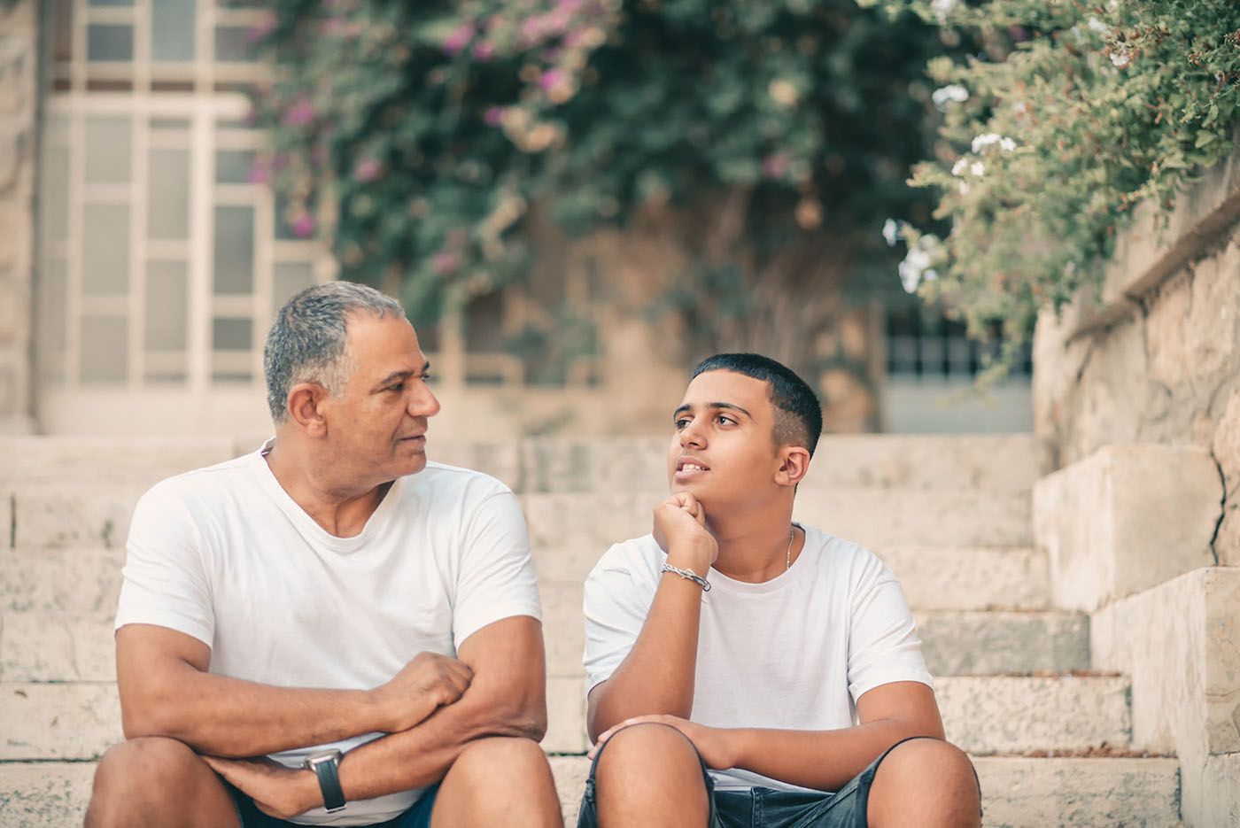 teen son talking with dad