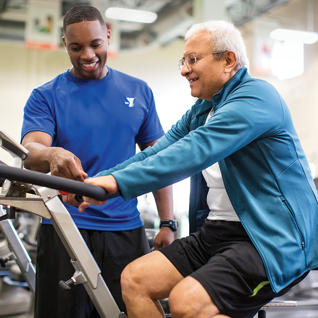 A YMCA personal trainer and a member 