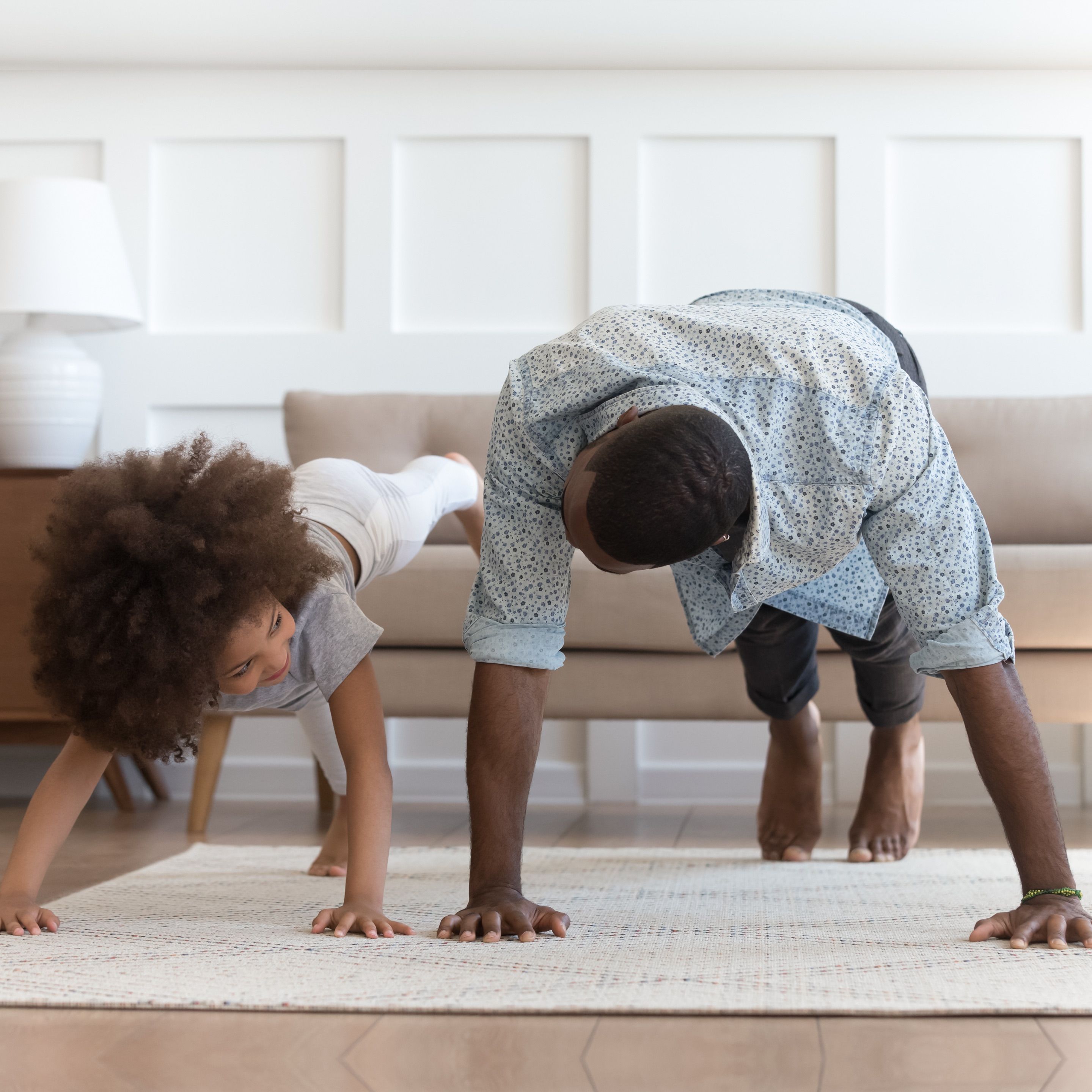 parent and child doing yoga together