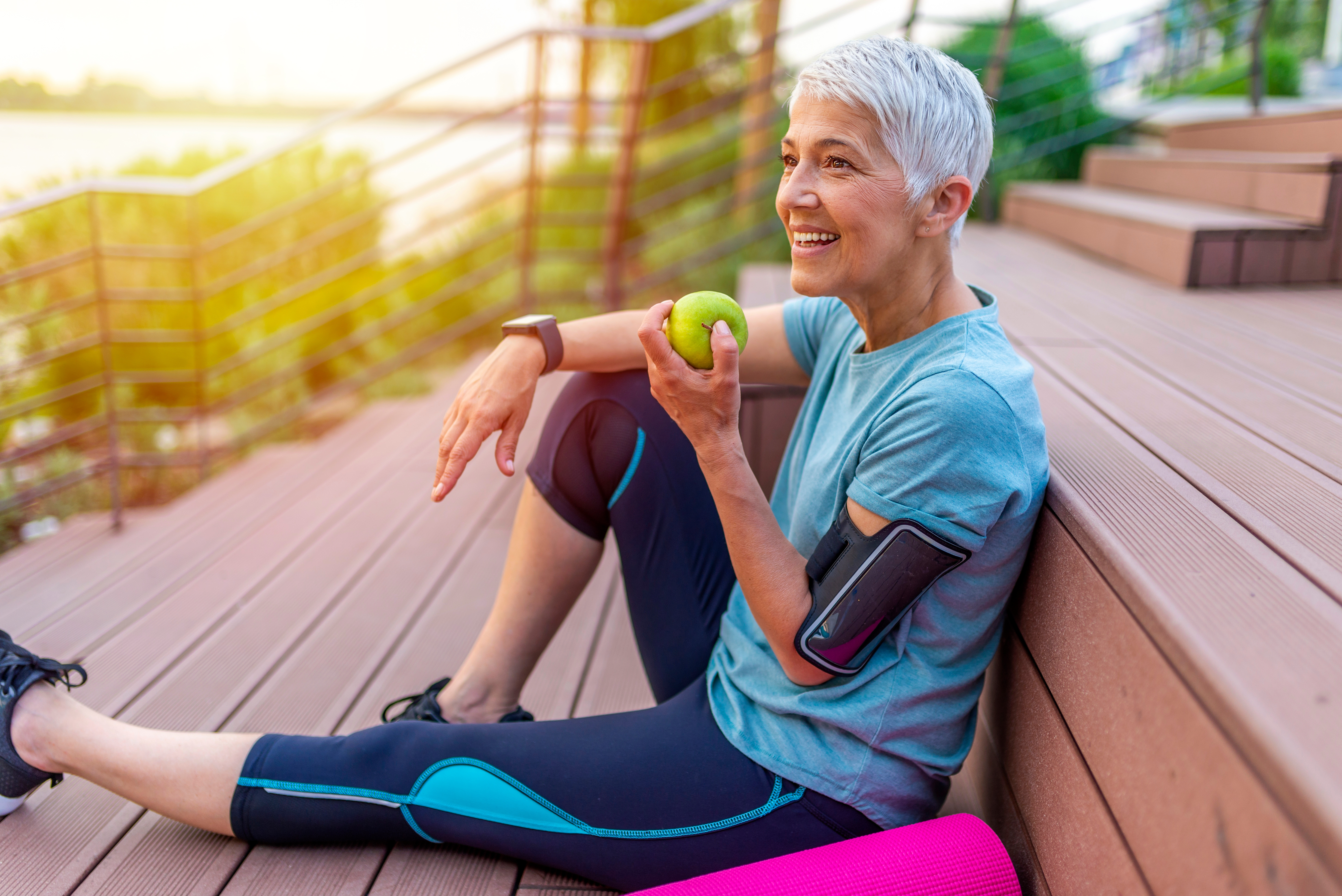 older woman eating healthy and exercising