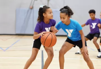 ymca youth basketball girls dribbling a ball