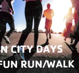 group of people running with text that says "twin city days 5k fun run/walk"