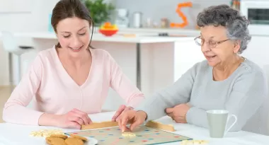 Two women playing a game of scrabble
