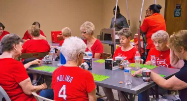 a group of women playing bingo at a ymca