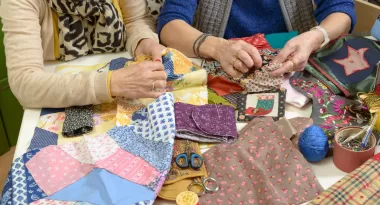 A group of women quilting at the ymca