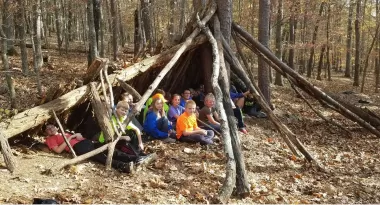 Kids in woods doing outdoor education