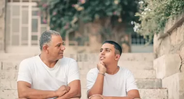 teen son talking with dad