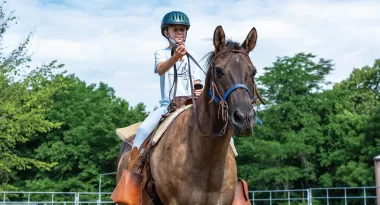 girl riding a horse at camp lakewood equestrian horseback riding camp