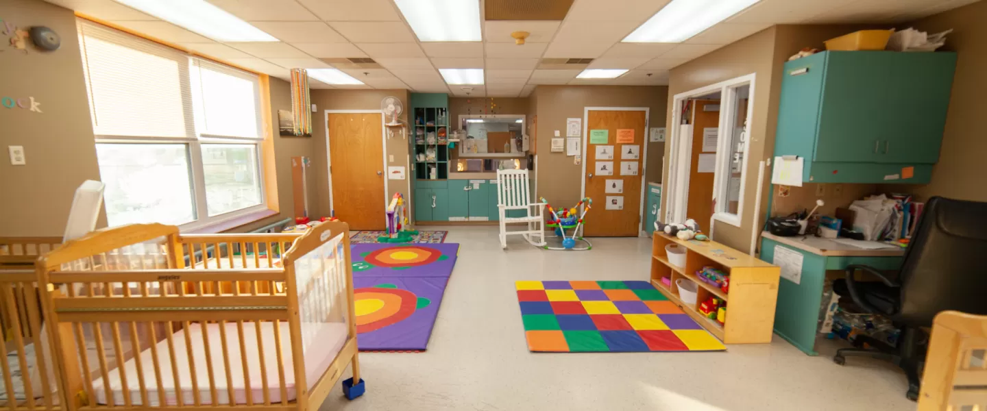 Tri-City YMCA Early Childhood Education Center Infant Area with Cribs