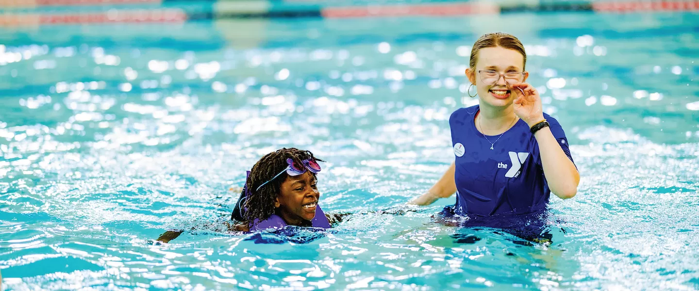 ymca pools and swimming with instructor and child swim lesson in indoor pool