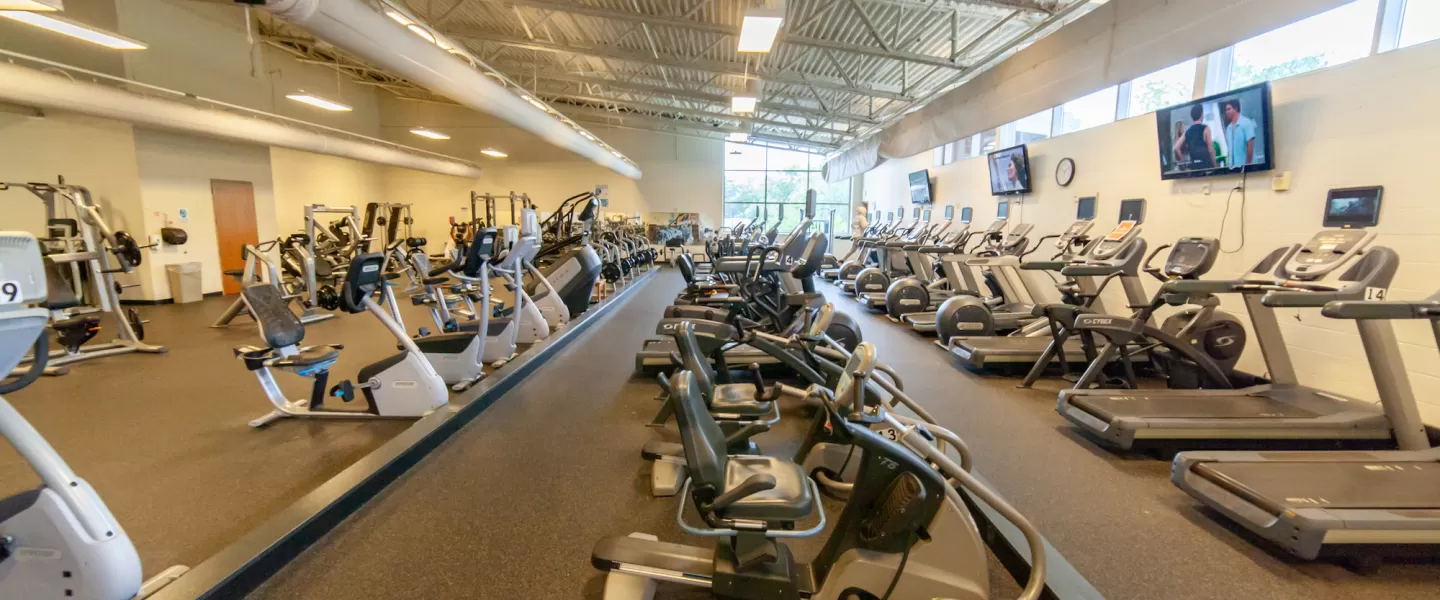 O'Fallon Park Rec Complex YMCA Fitness Center equipped with cardio machines, weight machines, treadmills, ellipticals, and more.