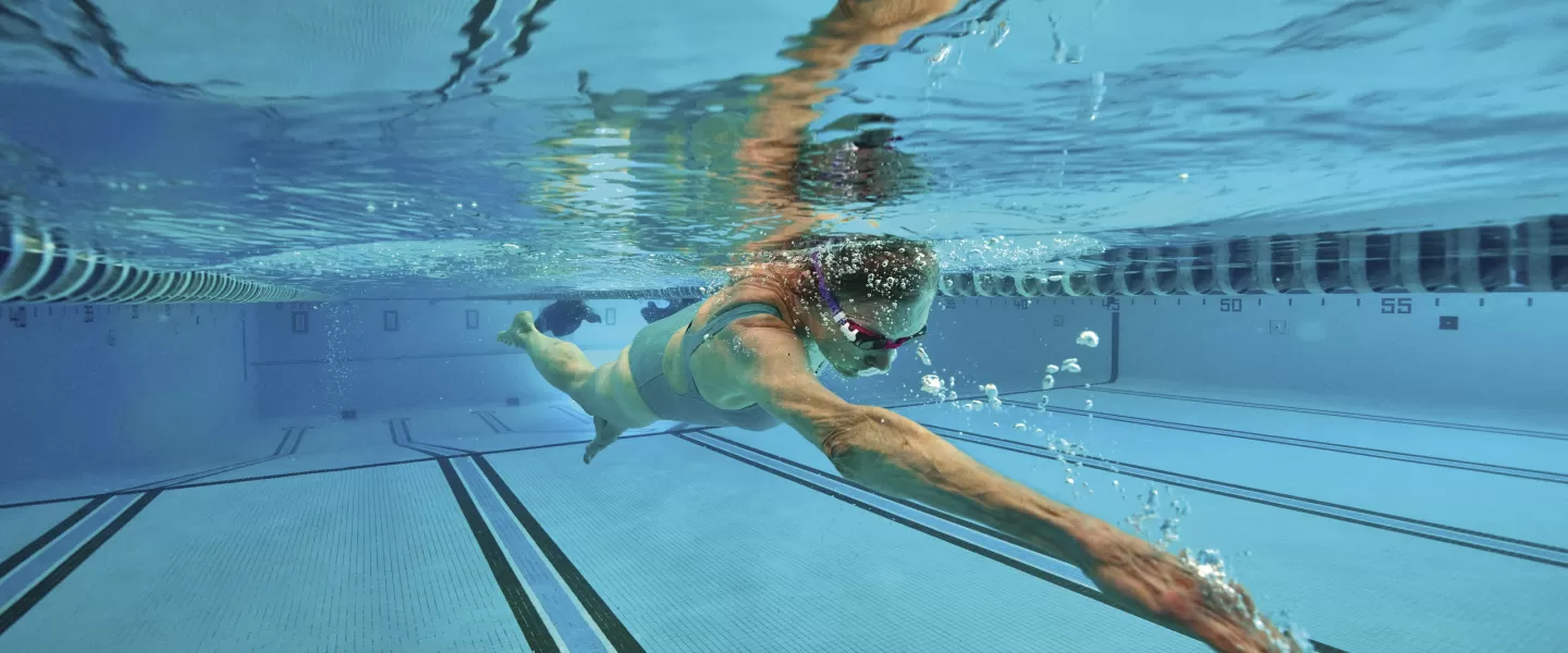 adult swimming at a ymca pool