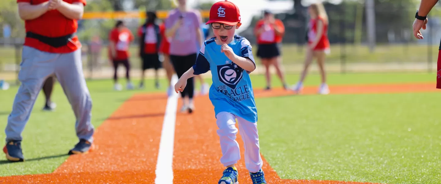 YMCA Adaptive Sports Complex Boy Scoring at Home Base