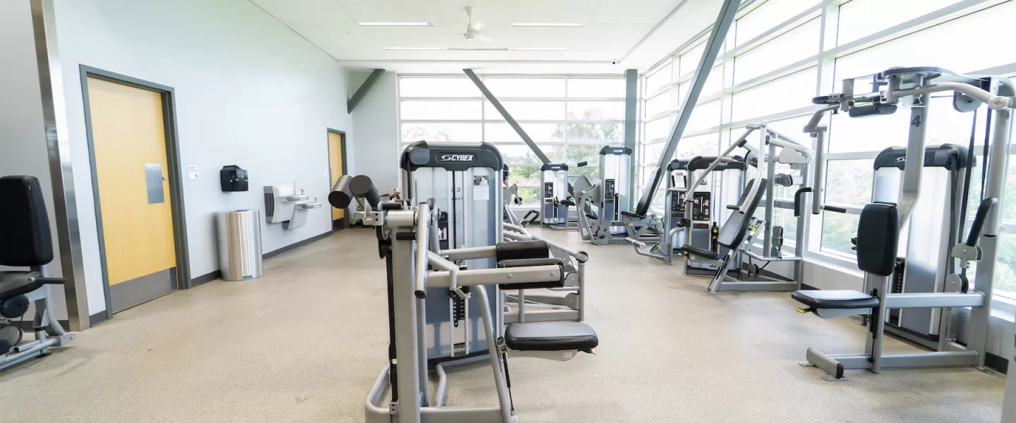 Alternate view of the renovated fitness center at Four Rivers YMCA showcasing new cardio and strength equipment, updated flooring, lighting, and fresh paint