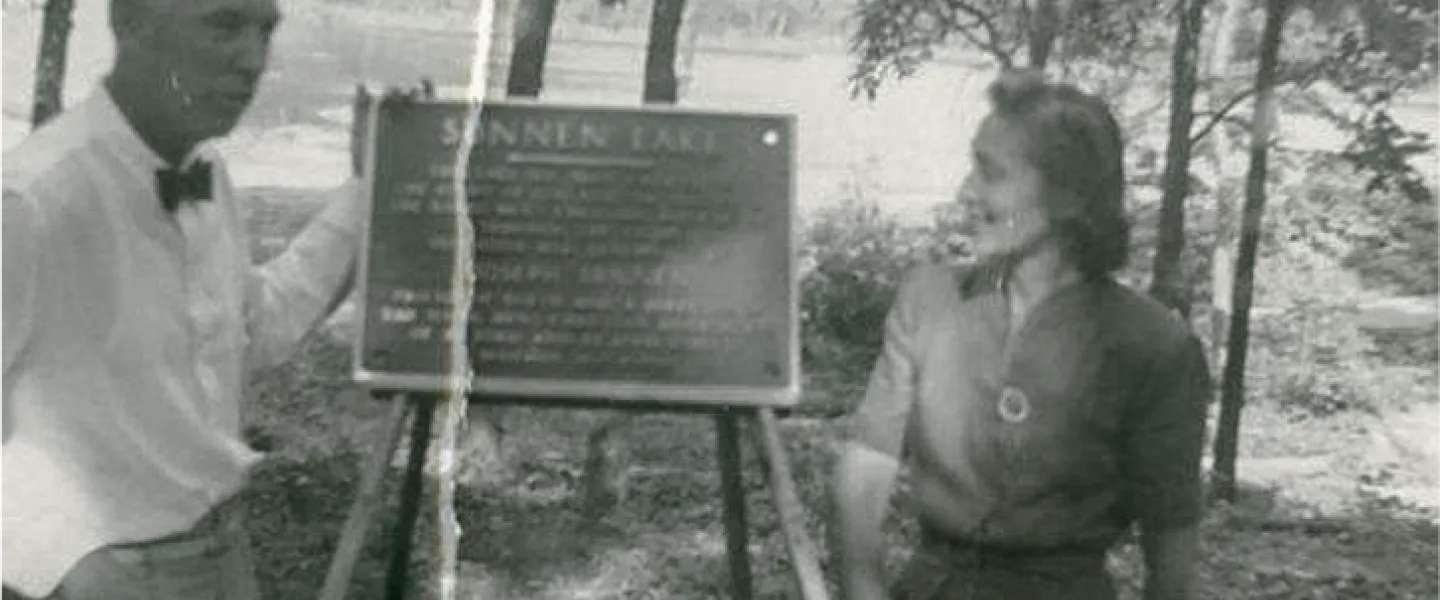 A black and white photo of Joseph Sunnen, the philanthropist who personally supervised the lake's construction, and his wife at the dedication and opening of Sunnen Lake.