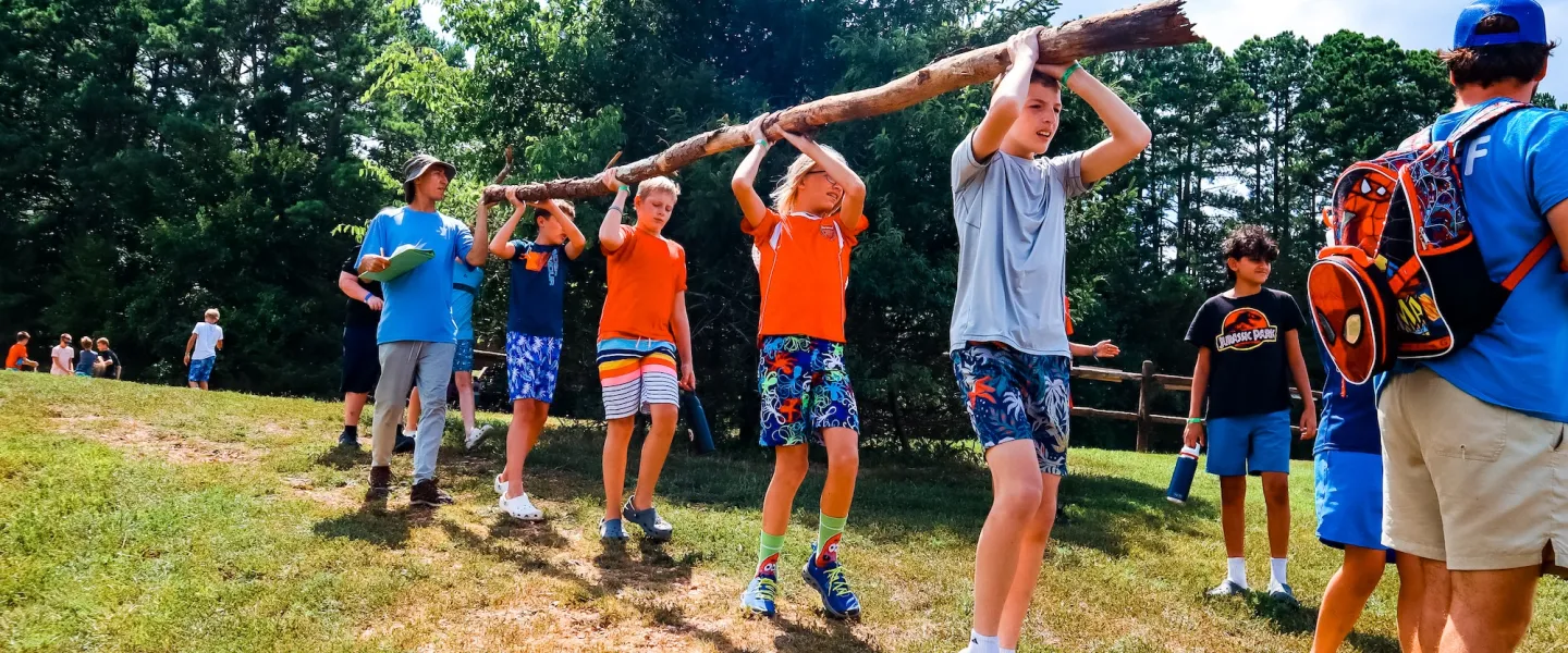 ymca camp lakewood 2025 campers carrying log