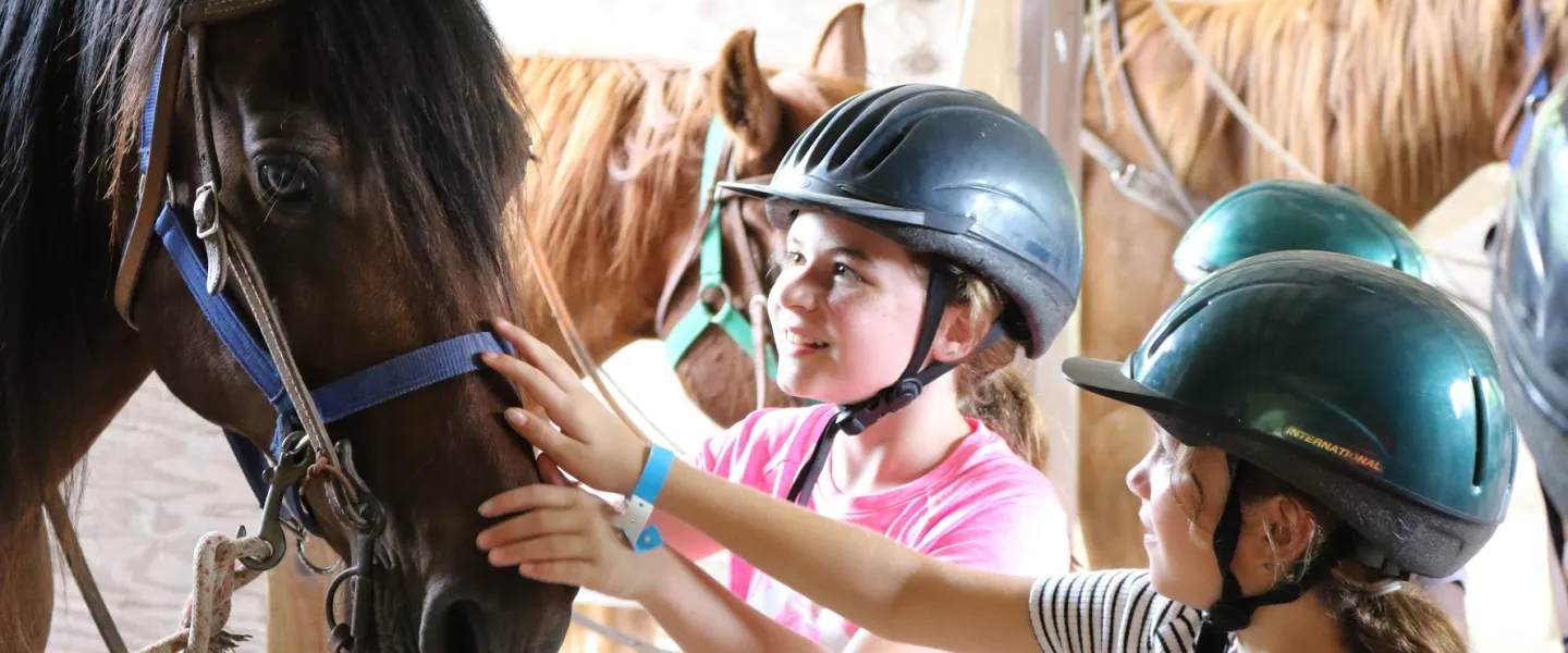 two girls with horse at triangle y ranch trout lodge