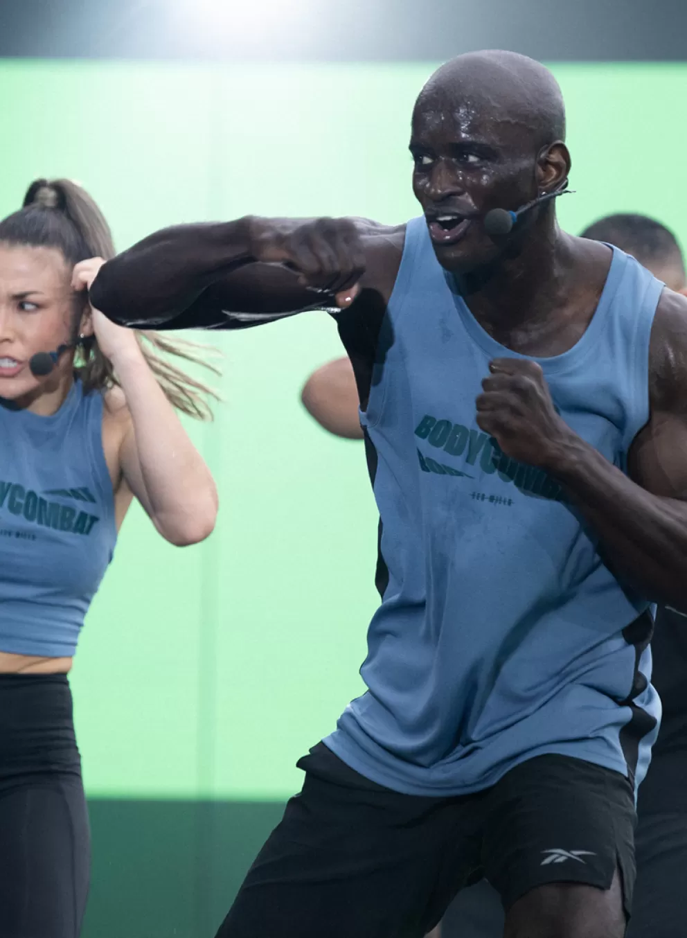 Les Mills BODYCOMBAT instructors demonstrating workout