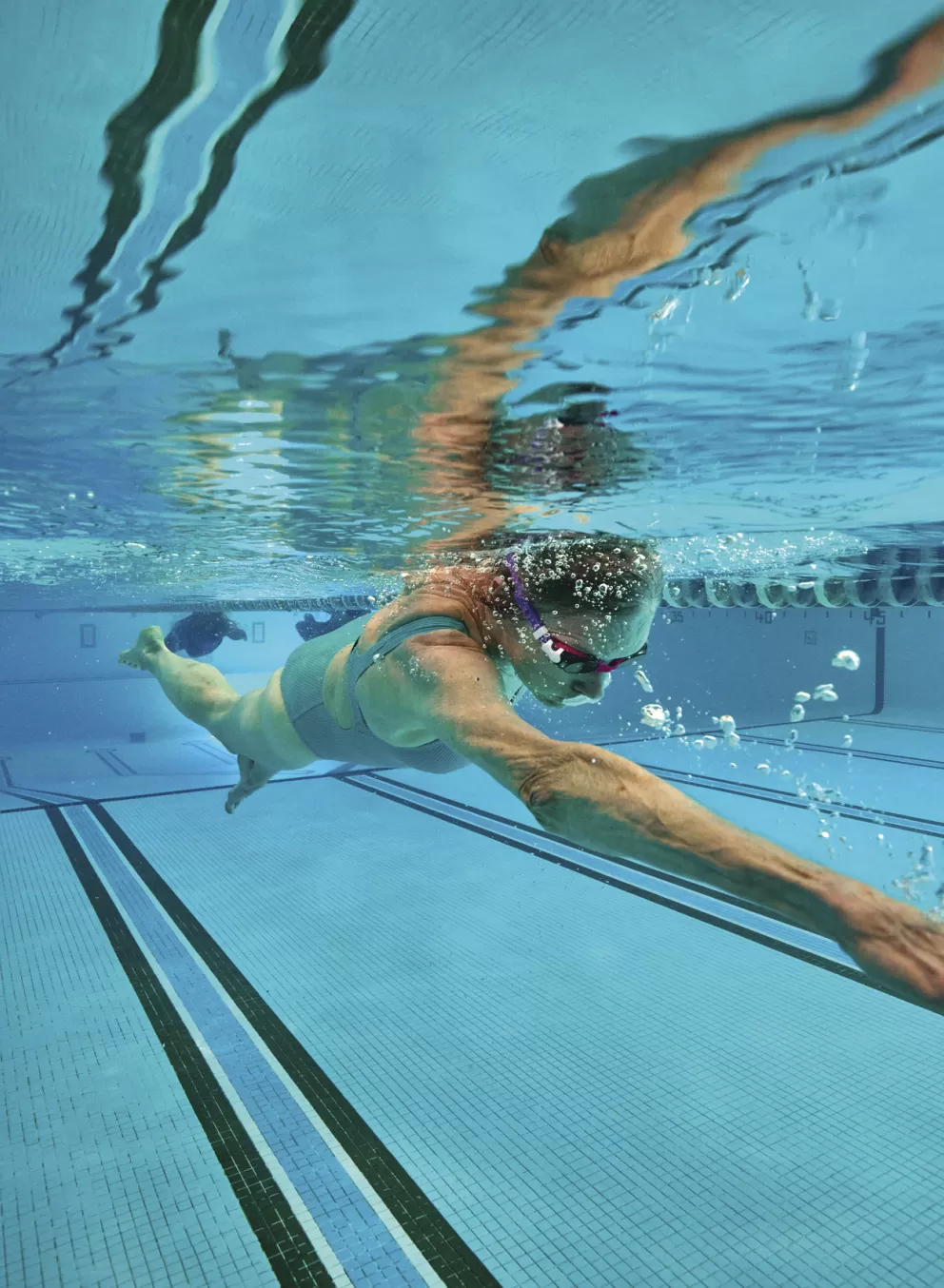 adult swimming at a ymca pool