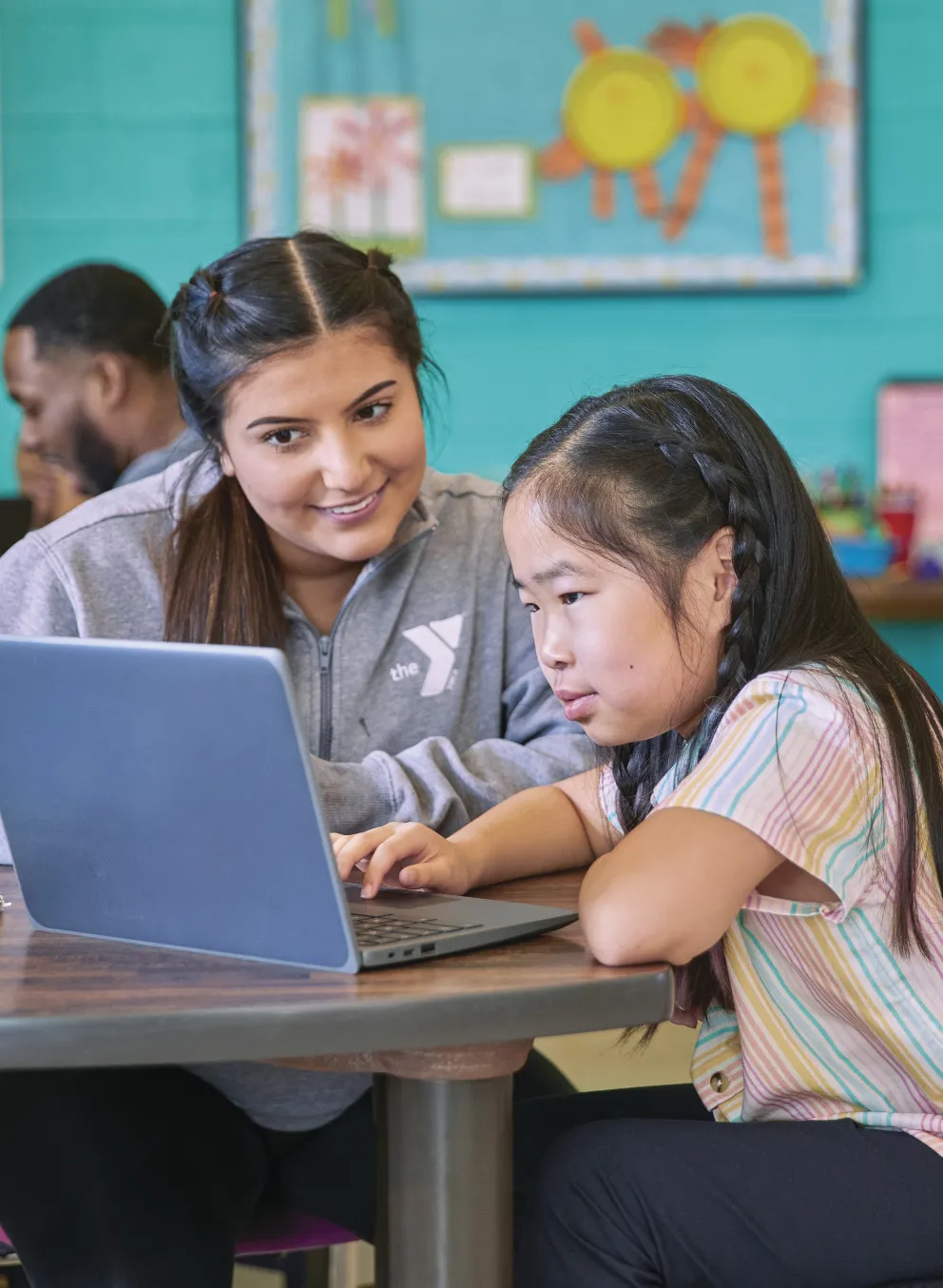 young woman tutoring a little girl at the YMCA