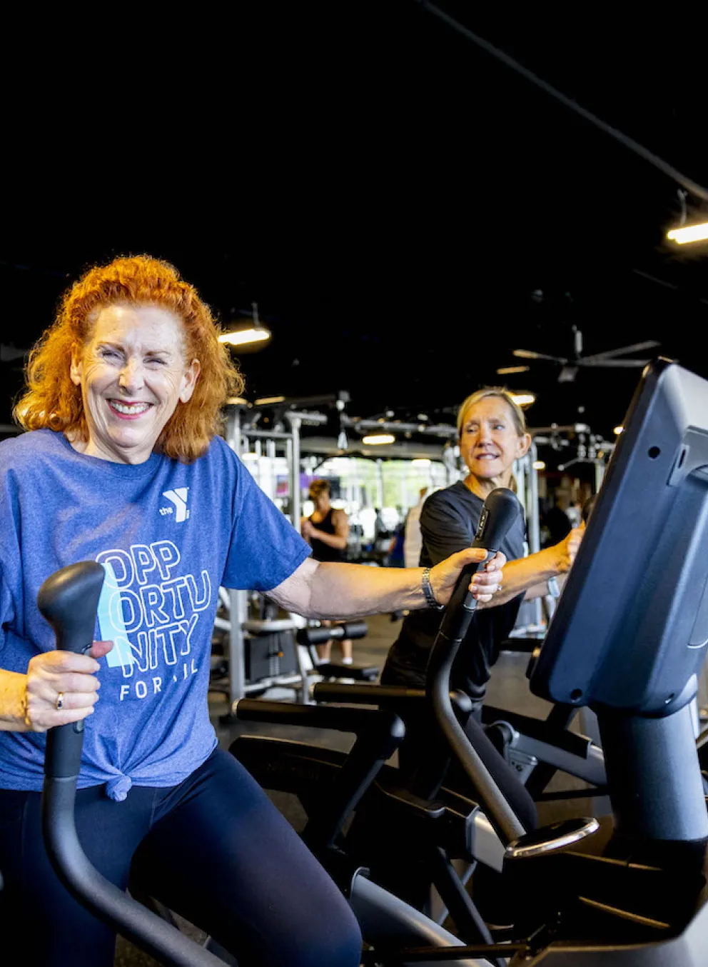 A woman performing a cardio workout on an elliptical fitness machine at the newly renovated Chesterfield Family YMCA in Missorui.