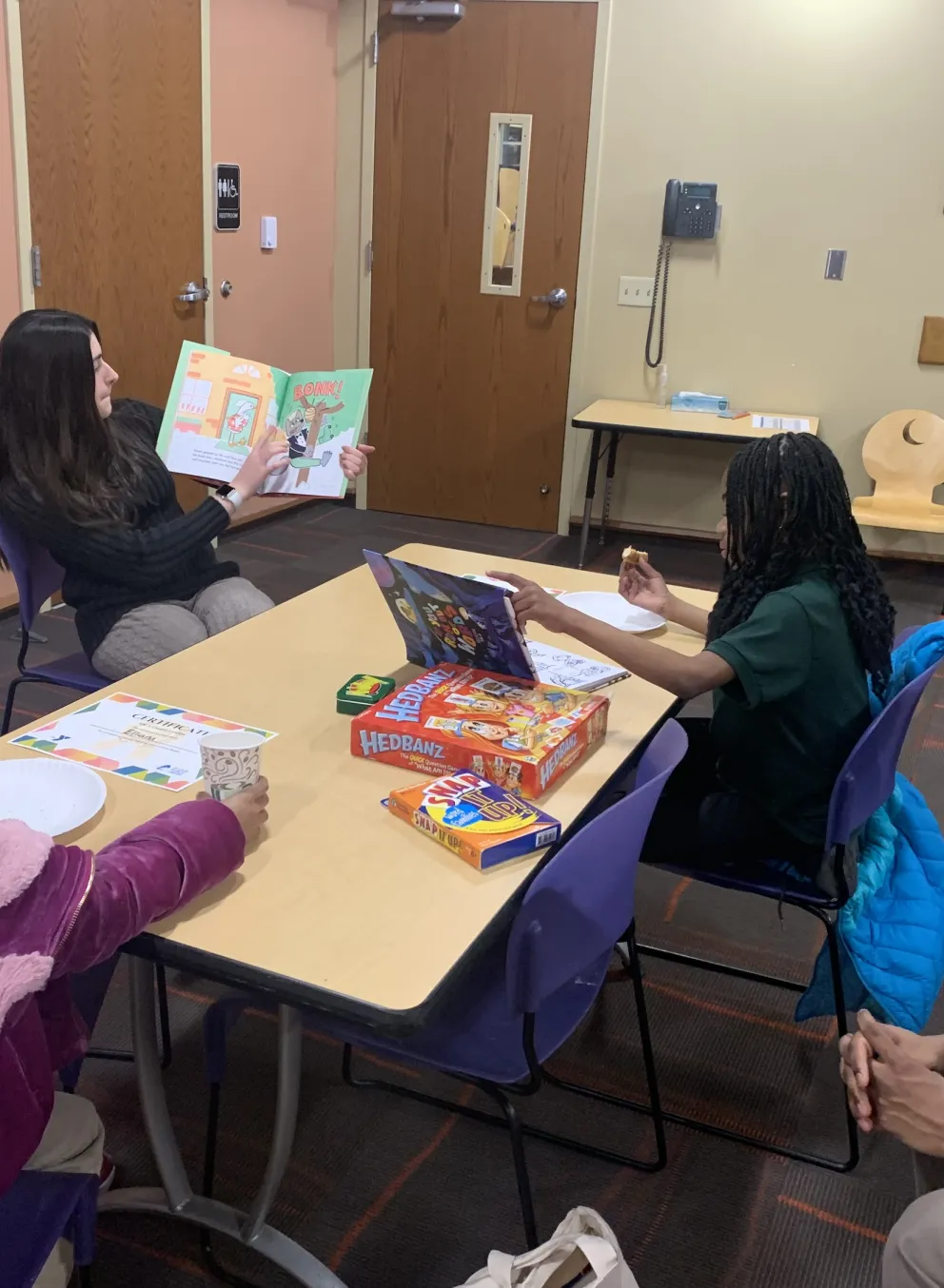 washu campus y student tutoring kids
