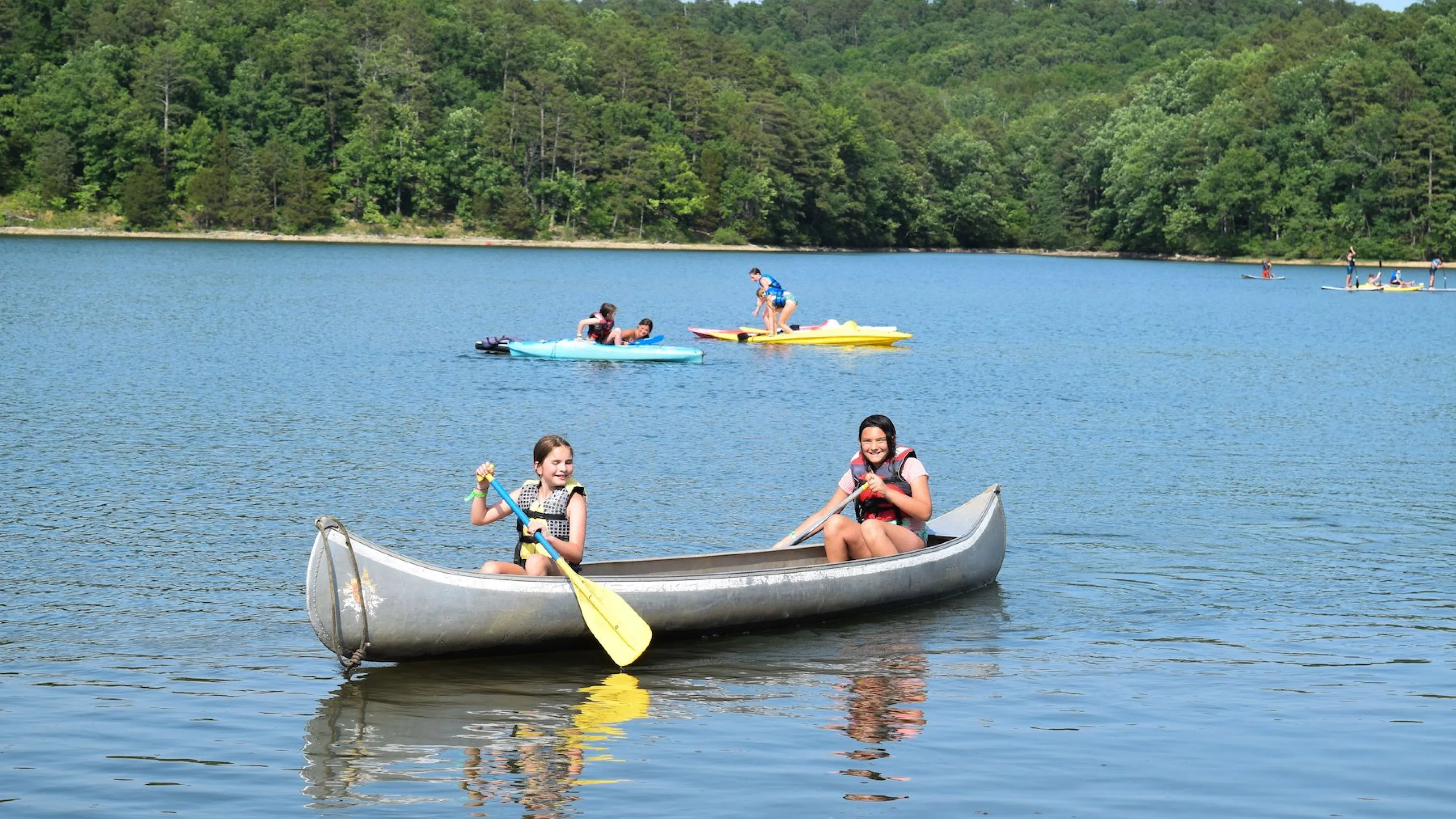 ymca camp lakewood girls in canoe on sunnen lake
