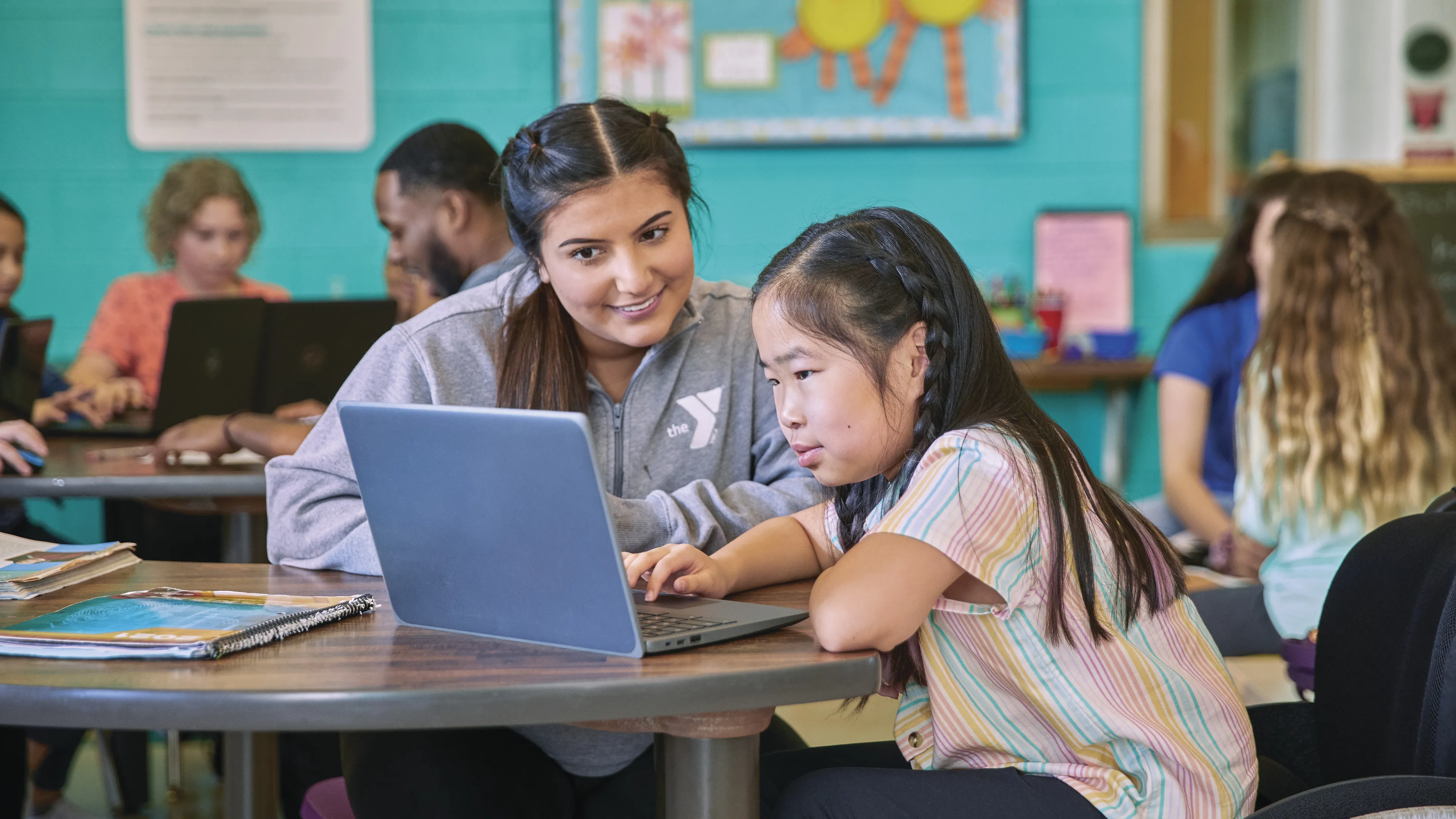 young woman tutoring a little girl at the YMCA