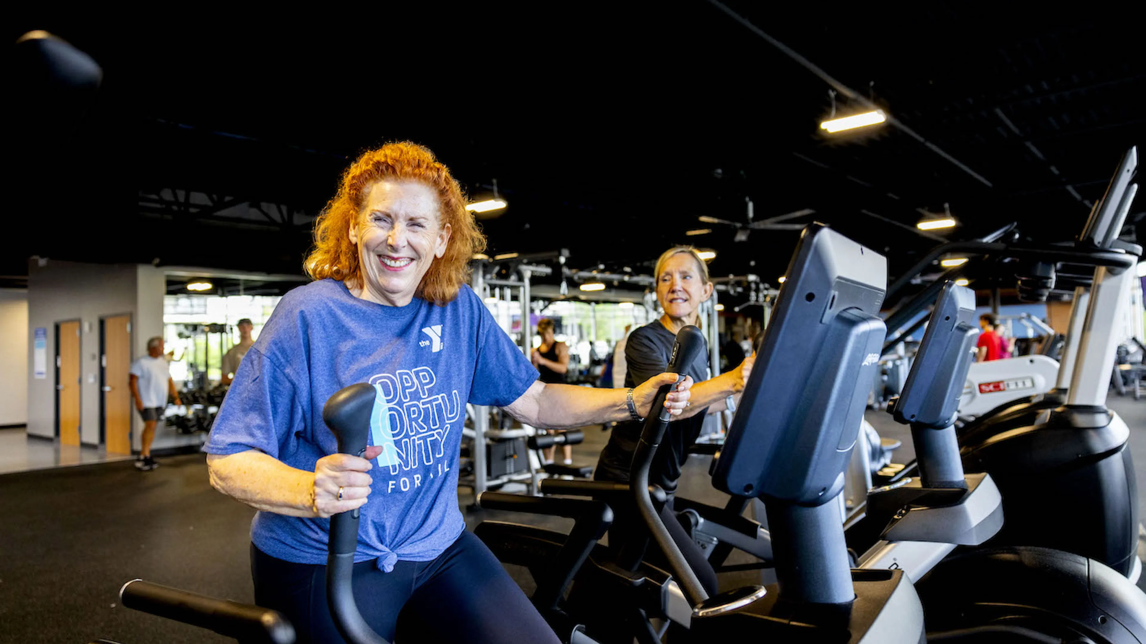 A woman performing a cardio workout on an elliptical fitness machine at the newly renovated Chesterfield Family YMCA in Missorui.