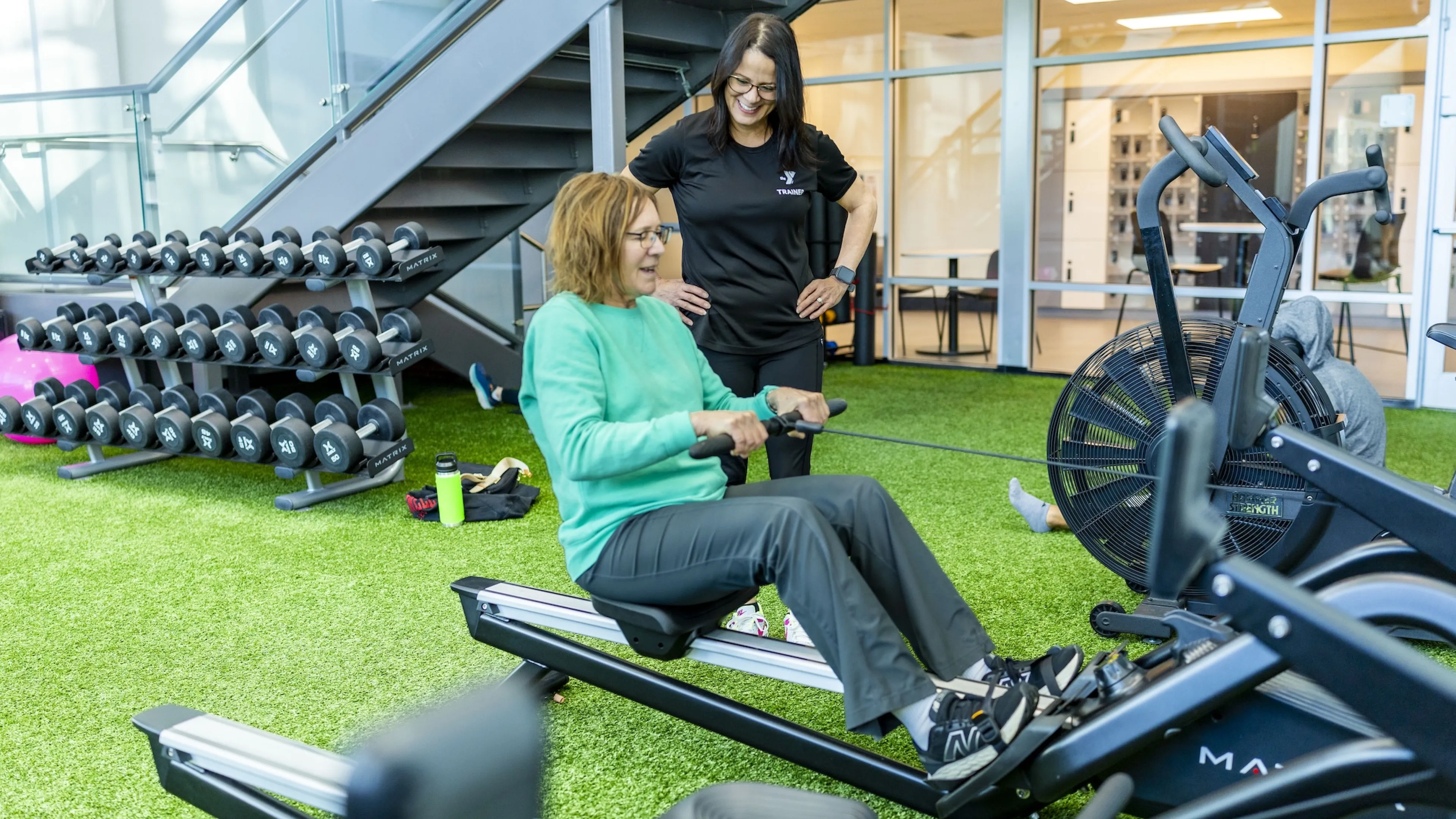 trainer giving a fitness orientation at the ymca