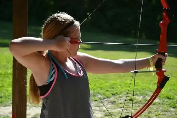 A girl doing archery at YMCA Trout Lodge