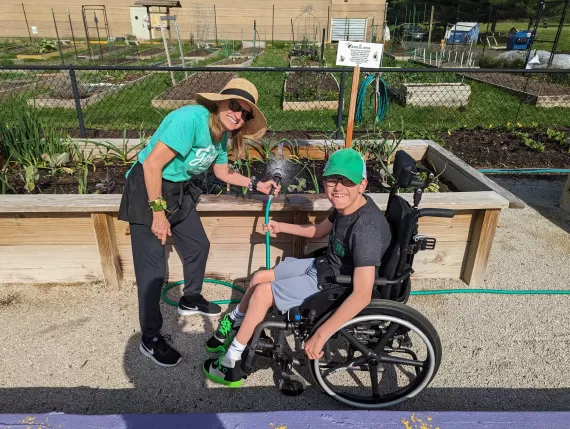 two people participating in adaptive gardening