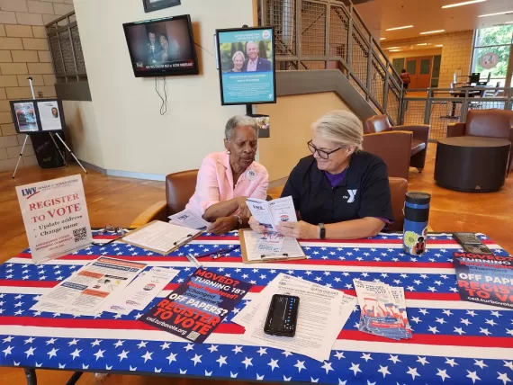 table at the ymca with voter registration information