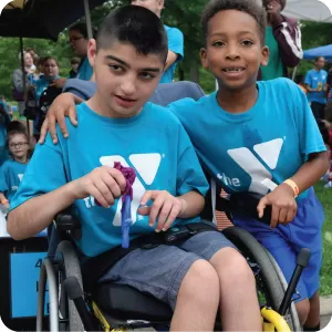 two kids attending inclusive ymca day camp 
