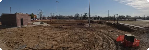 Construction at the Adaptive Sports Complex site. Two brick buildings of the complex are built. The frame of the scoreboard is in place.