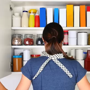 a woman looking at her pantry
