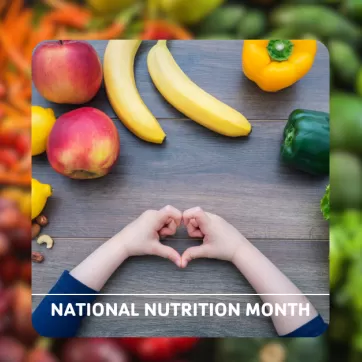 kids hand making a heart surrounded by fruit and vegetables with text that says "national nutrition month"