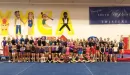 Thumbnail: An image of the entire South County YMCA Gymnastics team. All ages and levels are present. The image was taken in the gymnastics and tumbling room in front of the wall with the word YMCA painted onto the wall.