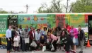 Thumbnail: An image of the diverse group who helped run and volunteer to work on the YMCA's Metro Market Bus.