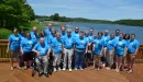 Thumbnail: Family group in blue shirts