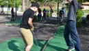 Thumbnail: Two boys playing mini golf