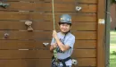 Thumbnail: Boy at climbing tower at Family Camp