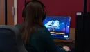 Thumbnail: A young, Caucasian female captured playing rocket league on a computer at the YMCA inside of the Esports arena.