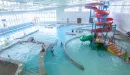 Thumbnail: Indoor pool area, including lap lanes, whirpool, children's play area, and slide.