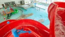 Thumbnail: Indoor pool shown from atop two-story water slide.