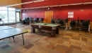 Thumbnail: Large teen room with ping pong table, pool table, and esports computers.
