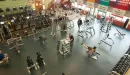 Thumbnail: Lower level free weight and cardio machine area shown from overhead track.