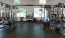 Thumbnail: Synergy360 training machine with multiple training modules, including overhead bars, ropes, and kettlebells