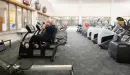 Thumbnail: Cardio area with rows of treadmills, ellipticals, and zero-impact trainers. Wide rows between equipment.