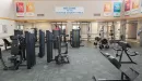 Thumbnail: Weight machines throughout room. Wide paths between equipment.